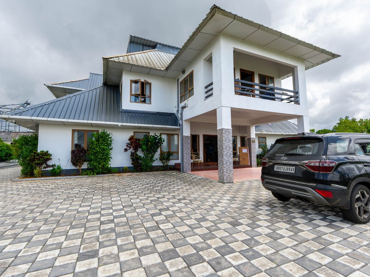 Front of the two-storey Zen Garden Vagamon bungalow with its paved courtyard