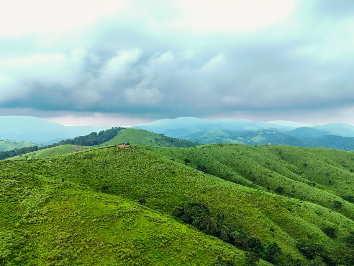 Rolling grass-top hills near Zen Garden Vagamon under a cloudy sky