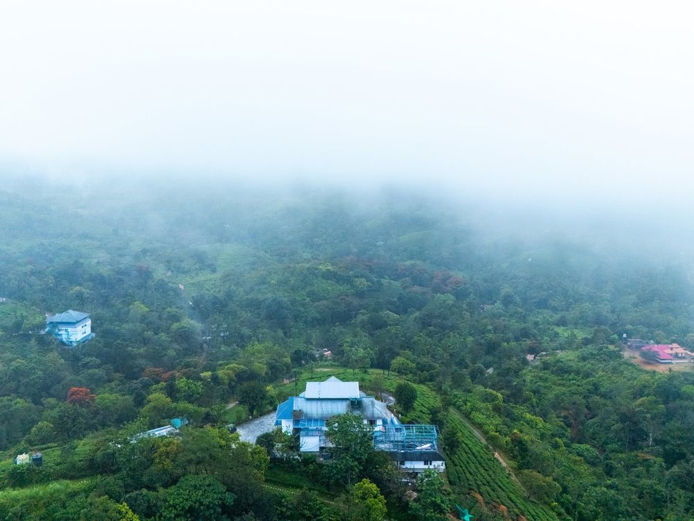 Sunrise over misty valleys near Zen Garden Vagamon